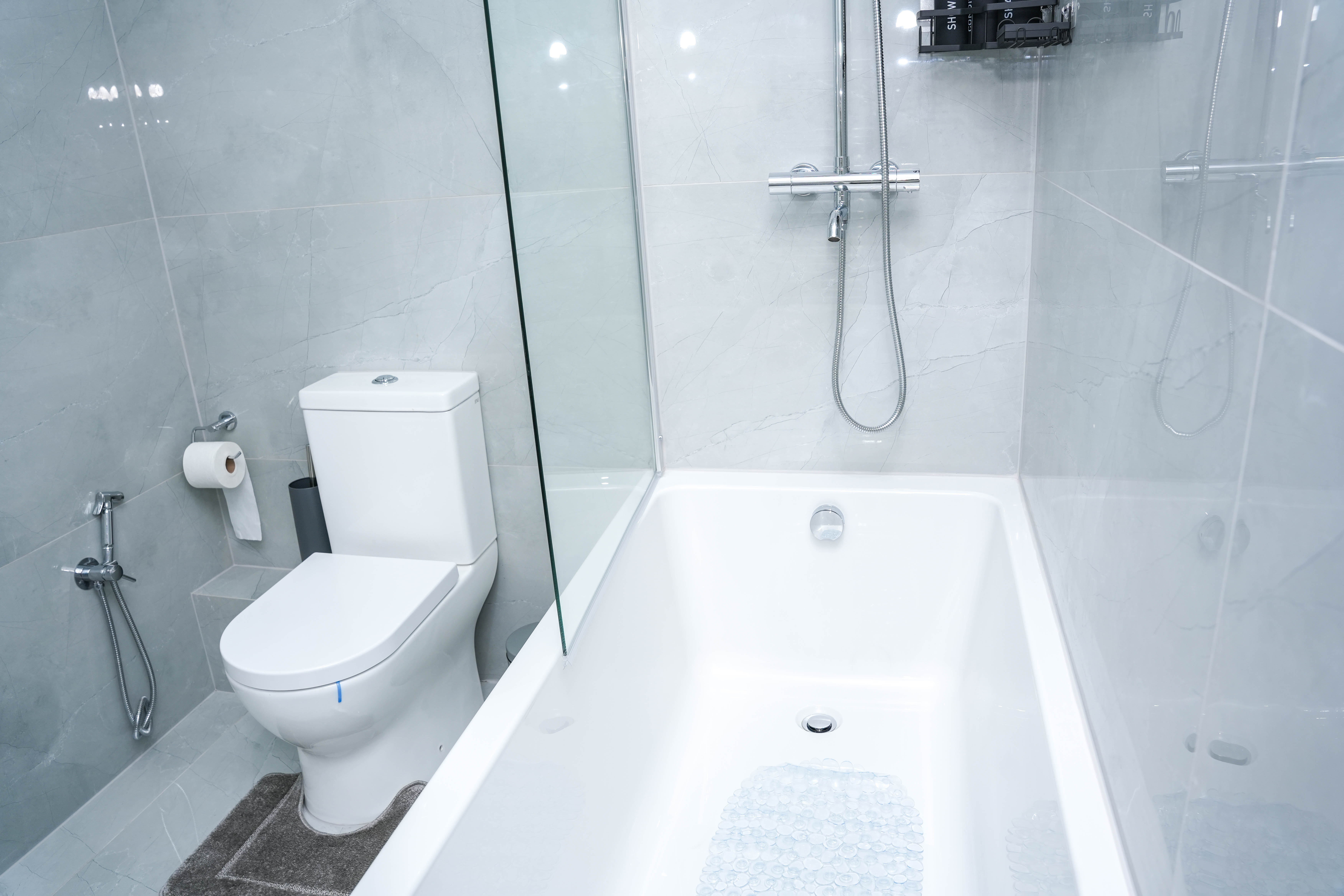 Bathroom at the Hounslow 4-Bedroom Home, alternate angle showing bath and shower