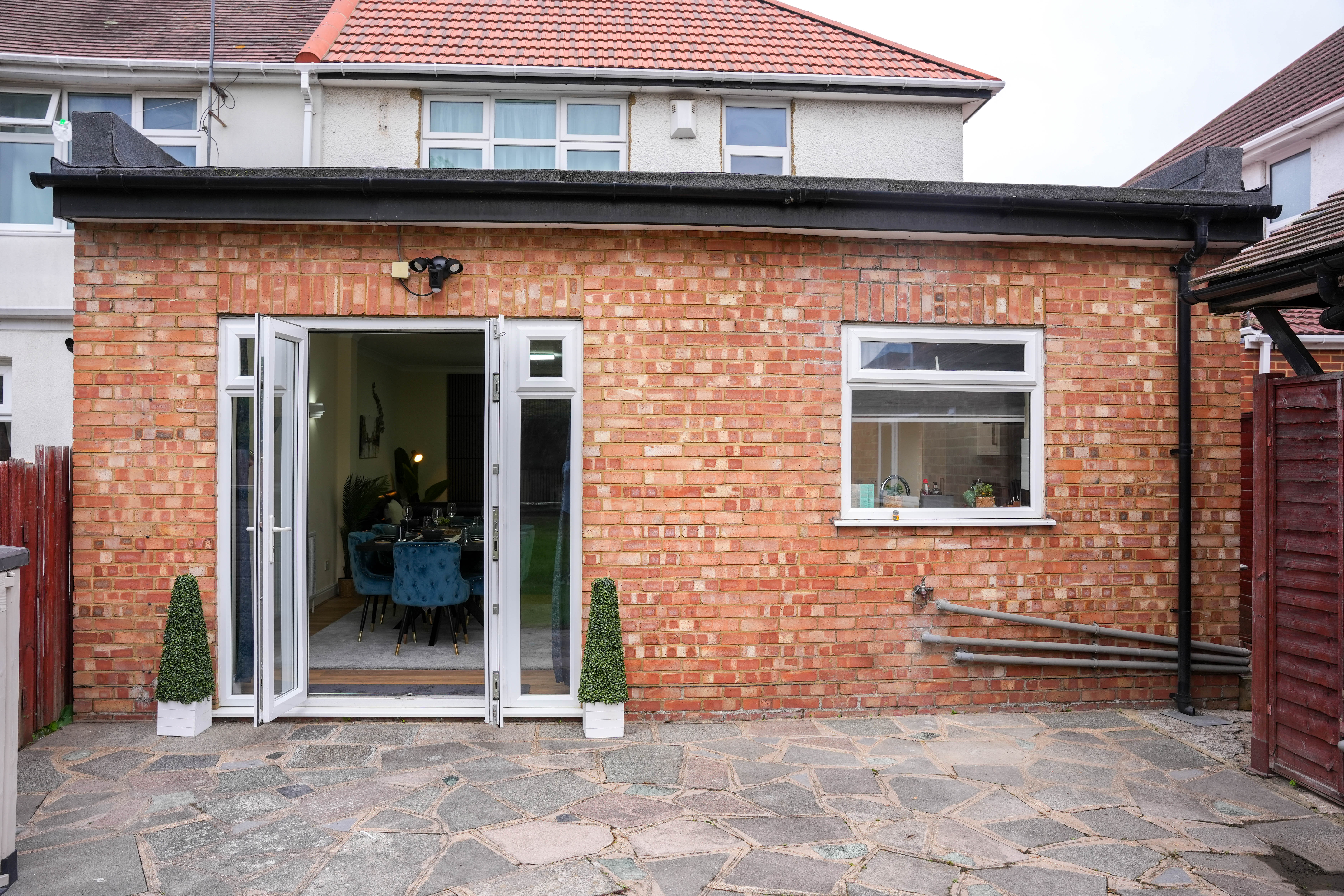 Rear exterior and patio at the Hounslow 4-Bedroom Home